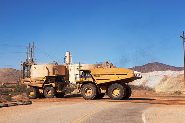 Caterpillar 777D Trucks crossing US 191, Freeport-McMoran Copper & Gold, Morenci, Arizona