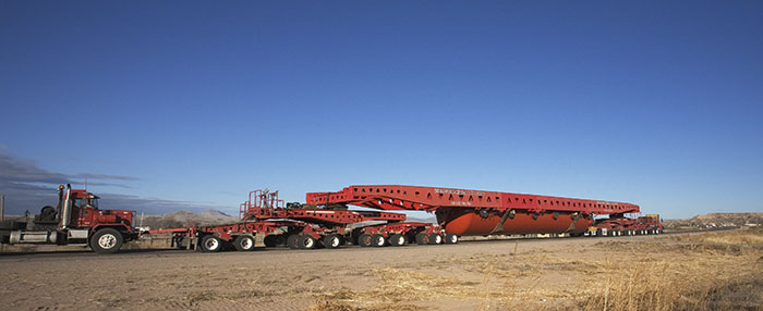 Trucks Hauling Large Autoclave