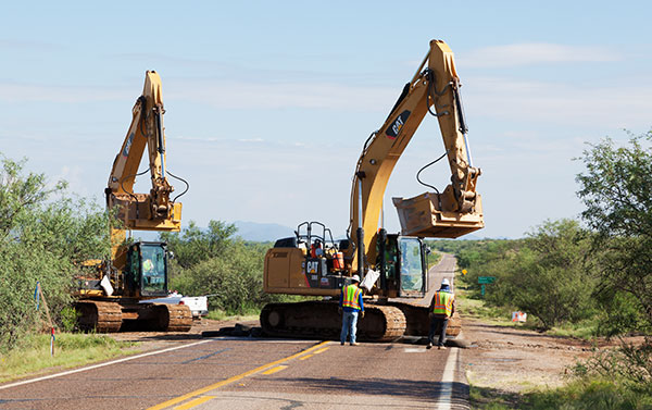 Caterpillar  336E excavators crossing SR 286  Arizona