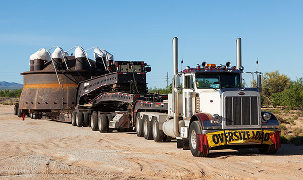 Truck with oversize load  on lowboy trailer  Arizona