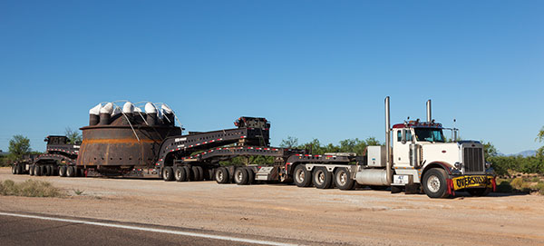 Truck with oversize load  on lowboy trailer  Arizona
